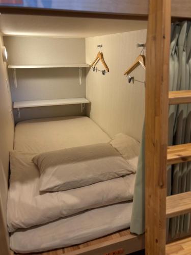a bedroom with two bunk beds in a room at Hostel Wasabi Asakusa in Tokyo
