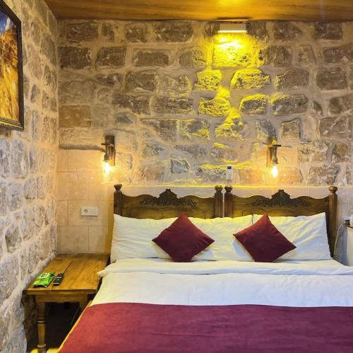 En eller flere senge i et værelse på Kasr-ı Han Konağı Otel