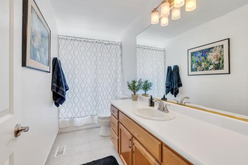 a bathroom with a sink and a toilet at Over The River in Kinney Estates