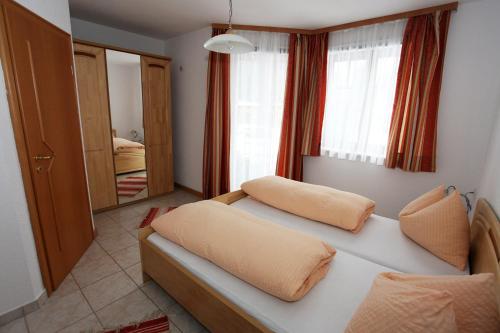 A bed or beds in a room at Appartementhaus Sabine