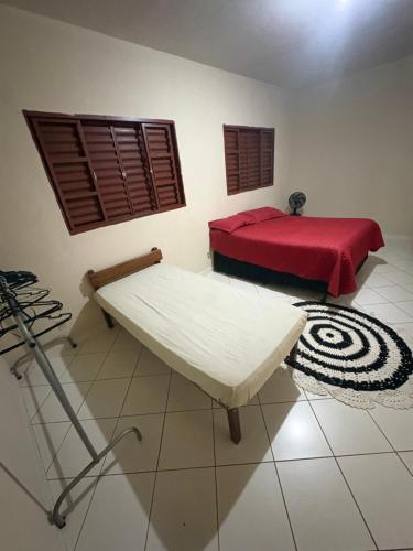 Ένα ή περισσότερα κρεβάτια σε δωμάτιο στο Pousada cosmo