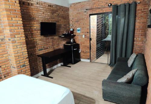 a living room with a couch and a piano at Habitación standard - SKYHOME I in Luque