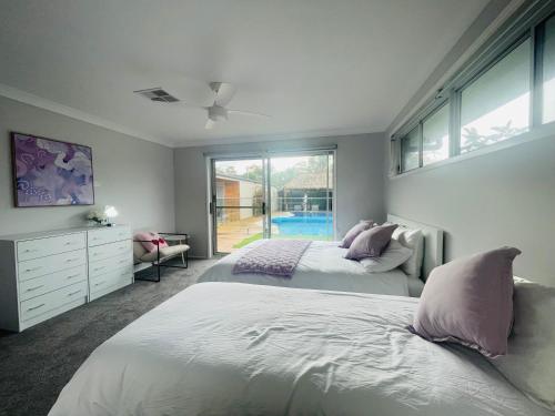 Ένα ή περισσότερα κρεβάτια σε δωμάτιο στο Balinese Vacation Home