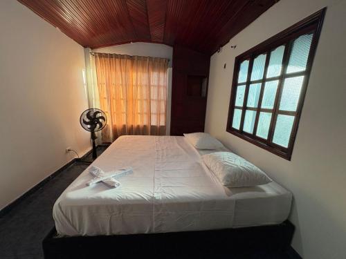 a bedroom with a large bed with a window at Apartamento Monterrey in Monterrey