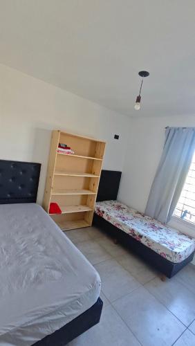 En eller flere senge i et værelse på Cabaña la Fride