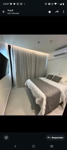 Giường trong phòng chung tại Porto 2 Life GAV RESORT B 2 apt 415