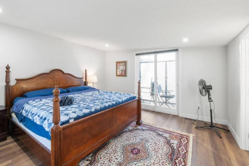 a bedroom with a bed and a camera on a tripod at Spacious Home • 3BR • Close to Whyte and Downtown in Edmonton