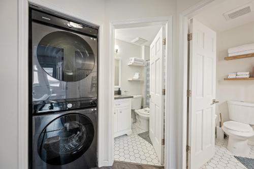a laundry room with a washer and dryer at Private Hot Tub | Pool | AC | Free Parking in Whistler
