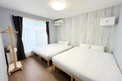 Ένα ή περισσότερα κρεβάτια σε δωμάτιο στο OKINAWA POOLWILLA ONNA 4A - Vacation STAY 48422v