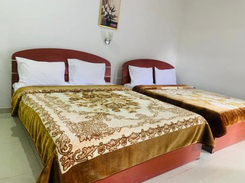 Ένα ή περισσότερα κρεβάτια σε δωμάτιο στο Misty Crown