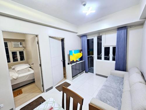 Ένα ή περισσότερα κρεβάτια σε δωμάτιο στο Riverview Suites Manila