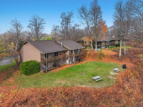 an aerial view of a house with a yard at Torch Lake Vista A Ga Ming Golf Retreat 741 Unit 9B in Creswell