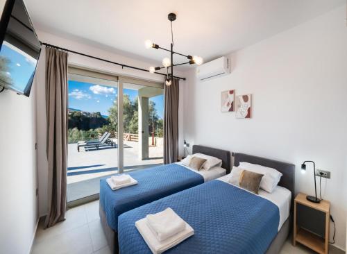 Giường trong phòng chung tại Kristi by Vintage Travel