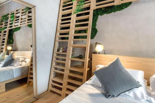 a bedroom with two bunk beds and a ladder at Benci House in Florence
