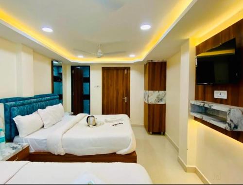 Ένα ή περισσότερα κρεβάτια σε δωμάτιο στο hotel saffron