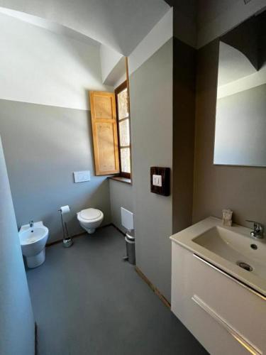 a bathroom with a sink and a toilet at La Locanda della Mandria 1 in Venaria Reale