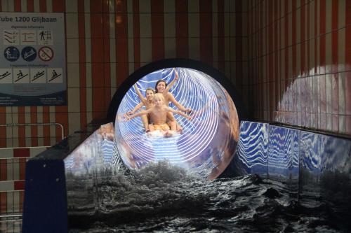two people riding a wave in a water ride at Villapark de Paardekreek in Kortgene