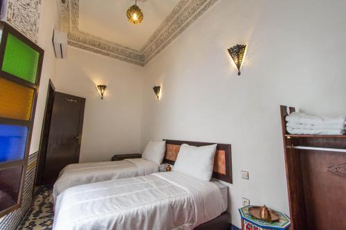Cama o camas de una habitación en Riad Taha