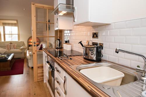 A kitchen or kitchenette at Fort Charlotte