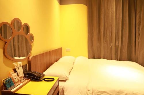 Ένα ή περισσότερα κρεβάτια σε δωμάτιο στο 星動行旅Star Travel