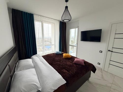 Säng eller sängar i ett rum på CityView Apartment