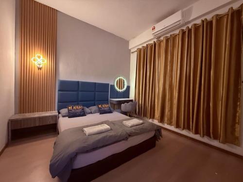 Ένα ή περισσότερα κρεβάτια σε δωμάτιο στο 仙本那镇上民宿-夏之家 Semporna Town Homestay-Summer Home