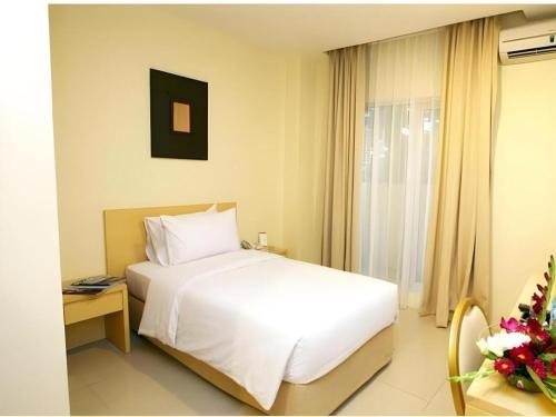 Una cama o camas en una habitación de Griya Sintesa