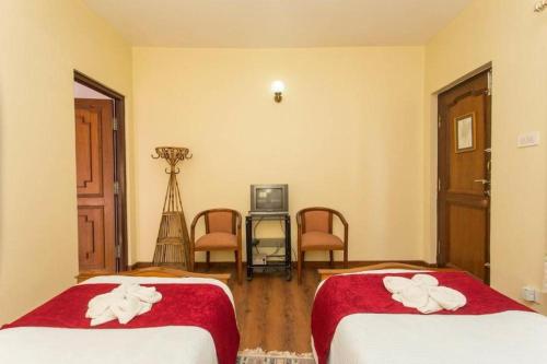 Ένα ή περισσότερα κρεβάτια σε δωμάτιο στο Hotel Norbu Sangpo