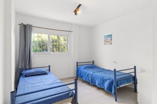 En eller flere senge i et værelse på Casa Paris