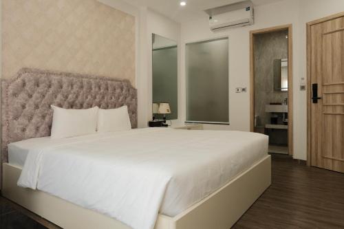 Ένα ή περισσότερα κρεβάτια σε δωμάτιο στο The Serenity Residence Ha Noi