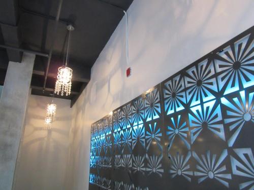 a room with a wall covered in blue tiles at Miami Sun Hotel - Downtown/Port of Miami in Miami