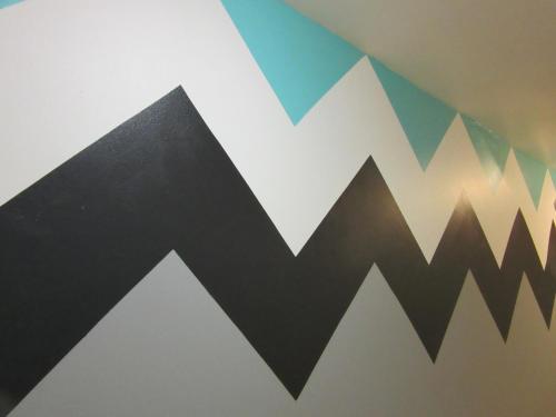 a mural of mountains on a wall at Miami Sun Hotel - Downtown/Port of Miami in Miami