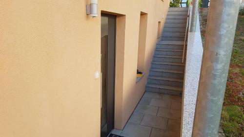 a staircase leading up to a building with a door at Ferienwohnung Bär in Schwäbisch Hall
