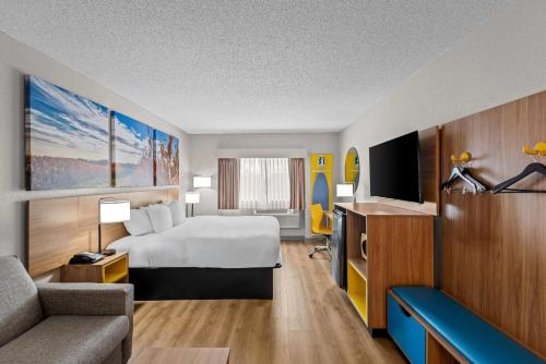 Postel nebo postele na pokoji v ubytování Days Inn by Wyndham Ames