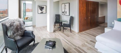 a living room with a chair and a table at Hotel on Rivington in New York