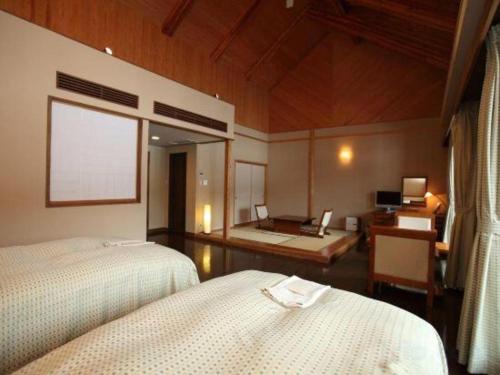 Voodi või voodid majutusasutuse TOYOTA Shirakawa-Go Eco-Institute toas