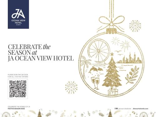 a christmas ornament in a ball with a christmas tree at JA Ocean View Hotel, Jumeirah Beach Dubai in Dubai