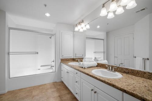 a bathroom with a sink and a large mirror at Modern 2BR Cozy Apartment in Irvine in Lake Forest