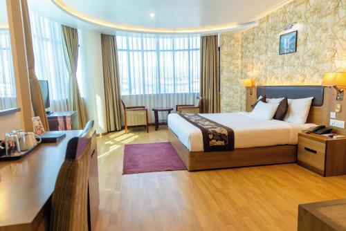 Postel nebo postele na pokoji v ubytování Hotel Mirage Regency