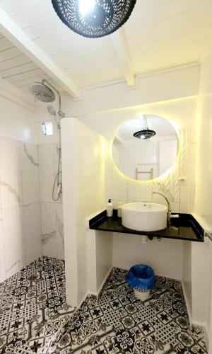 a bathroom with a sink and a mirror at Riad Ocean Medina in Essaouira