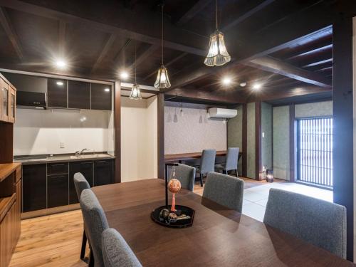 a kitchen and dining room with a table and chairs at Wow! KANAZAWA STAY in Kanazawa
