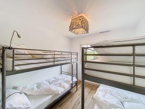 En eller flere senge i et værelse på Villa La Destenda