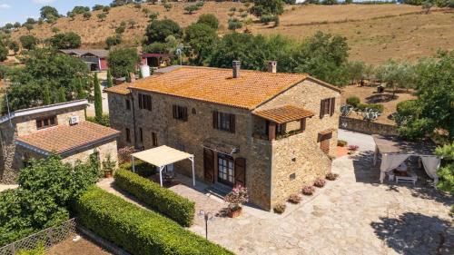 an aerial view of a large stone house at La Fontaccia 13 by VacaVilla in Montiano