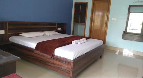 Ένα ή περισσότερα κρεβάτια σε δωμάτιο στο Chai Bagan Homestay By StayApart