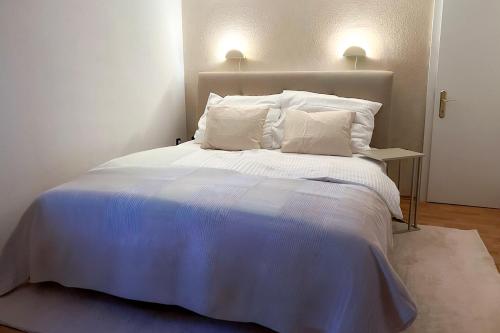 Кровать или кровати в номере Brunnalm Blick Apartment