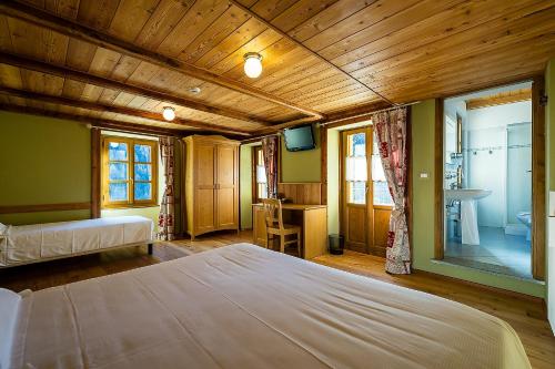 Postel nebo postele na pokoji v ubytování Mirtillo Alpino Casa Vacanze