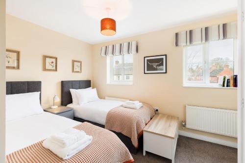 Voodi või voodid majutusasutuse Modern family home Parking Private garden - Pass the Keys toas