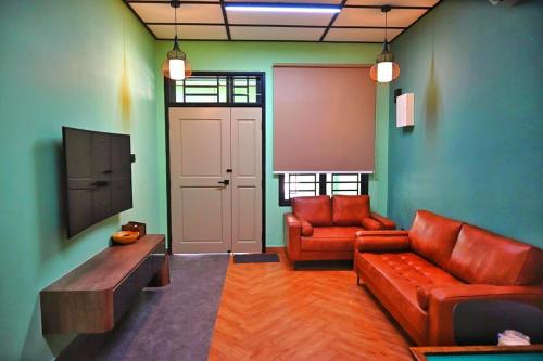 Un lugar para sentarse en Mint Cottage - 6 mins from Aeon Bukit Indah