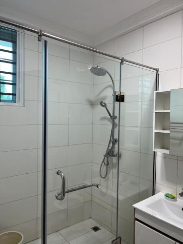 a shower with a glass door in a bathroom at Ankyease Aclove in Kotrope