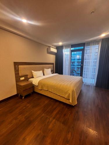 En eller flere senge i et værelse på La Quinta Batumi - Sea & Airport View